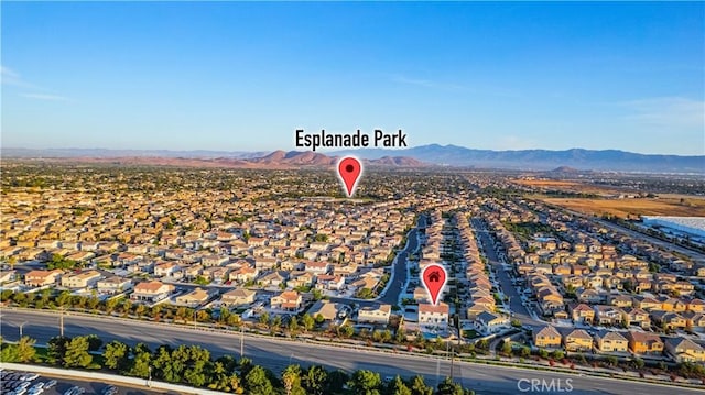 11715 Periwinkle Pl, Jurupa Valley, CA 91752 - aerial view of residential area with a mountainous background