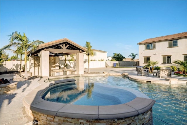 11715 Periwinkle Pl, Jurupa Valley, CA 91752 - view of swimming pool featuring a gazebo, a pool with connected hot tub, a fenced backyard, and a patio