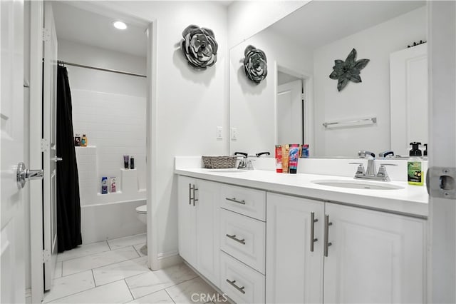 11715 Periwinkle Pl, Jurupa Valley, CA 91752 - bathroom with double vanity, marble finish flooring, shower / bath combo, and recessed lighting