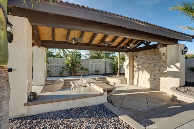 11715 Periwinkle Pl, Jurupa Valley, CA 91752 - fenced backyard featuring a ceiling fan and a patio