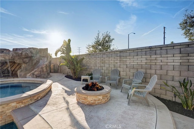 11715 Periwinkle Pl, Jurupa Valley, CA 91752 - fenced backyard with an outdoor fire pit, an in-ground hot tub, and a patio area