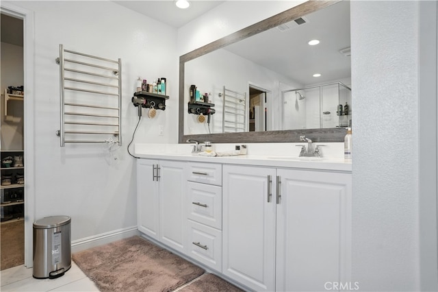 11715 Periwinkle Pl, Jurupa Valley, CA 91752 - bathroom with a shower stall, double vanity, recessed lighting, tile patterned flooring, and a towel warmer