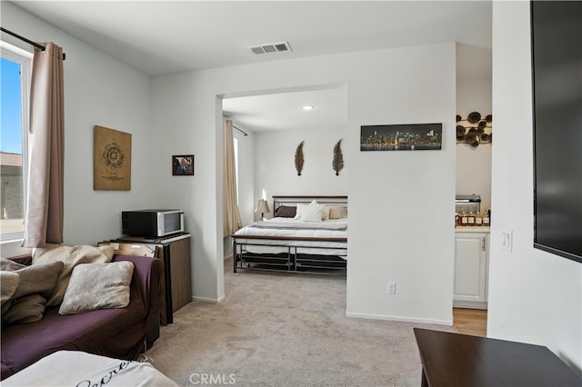 11715 Periwinkle Pl, Jurupa Valley, CA 91752 - bedroom featuring light colored carpet and multiple windows
