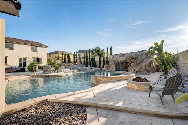 11715 Periwinkle Pl, Jurupa Valley, CA 91752 - view of pool featuring a fire pit, a patio, and a pool with connected hot tub
