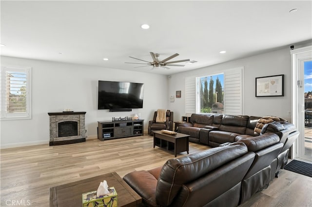 11715 Periwinkle Pl, Jurupa Valley, CA 91752 - living room with ceiling fan, recessed lighting, light wood-type flooring, and a fireplace