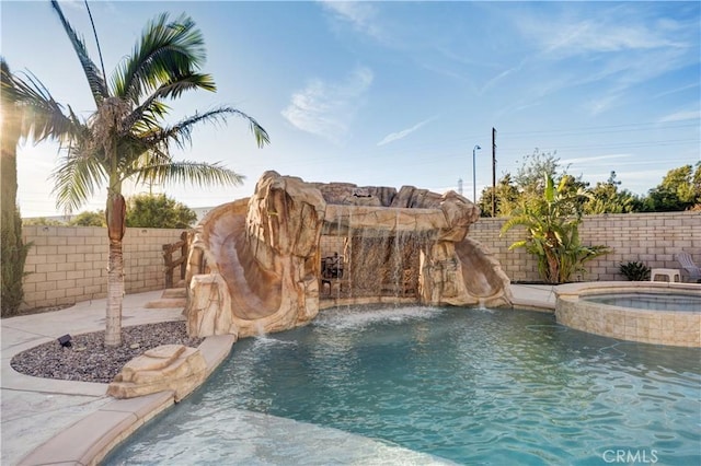 11715 Periwinkle Pl, Jurupa Valley, CA 91752 - view of swimming pool with a fenced backyard and a pool with connected hot tub