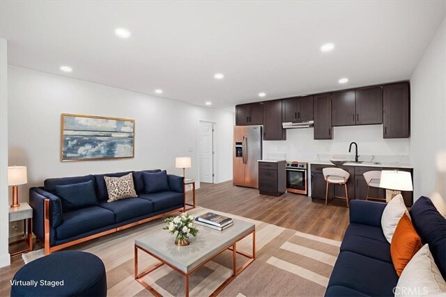 727 E 94th St, Los Angeles, CA 90002 - living area with light wood finished floors and recessed lighting