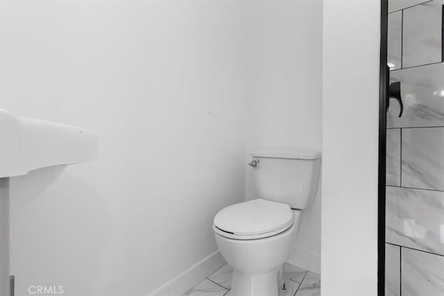 727 E 94th St, Los Angeles, CA 90002 - bathroom with marble finish flooring and baseboards