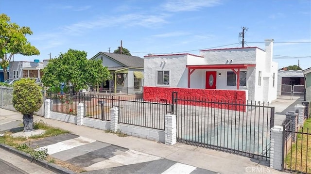 727 E 94th St, Los Angeles, CA 90002 - view of front of house featuring a fenced front yard and stucco siding