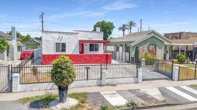 727 E 94th St, Los Angeles, CA 90002 - view of front of property with a fenced front yard and stucco siding