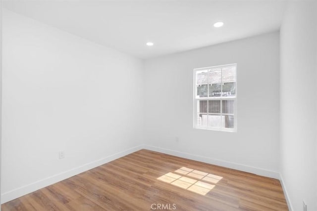727 E 94th St, Los Angeles, CA 90002 - empty room featuring wood finished floors and recessed lighting