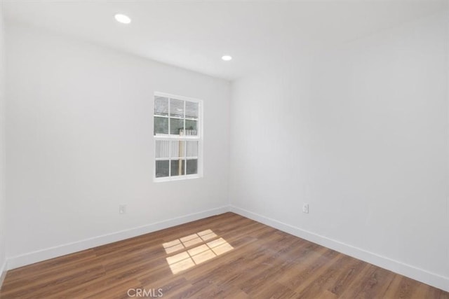 727 E 94th St, Los Angeles, CA 90002 - unfurnished room with wood finished floors and recessed lighting