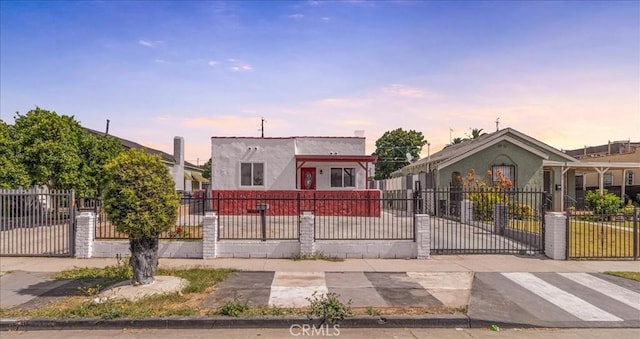 727 E 94th St, Los Angeles, CA 90002 - view of front of property with stucco siding and a fenced front yard