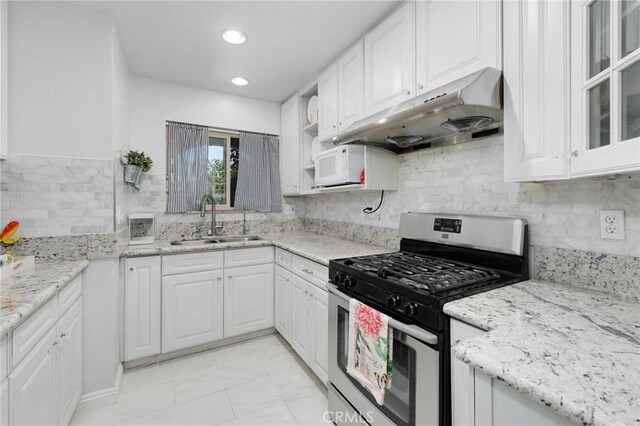 225 W Mission Rd Unit A, San Gabriel, CA 91776 - kitchen featuring stainless steel gas range oven, under cabinet range hood, white cabinets, light marble finish flooring, and light stone counters