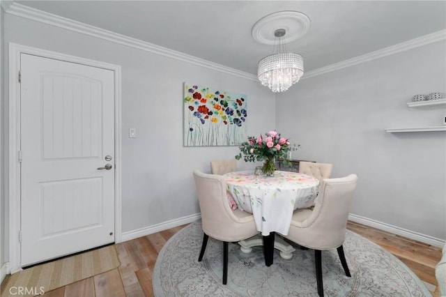 225 W Mission Rd Unit A, San Gabriel, CA 91776 - dining room featuring a chandelier, wood finished floors, and ornamental molding