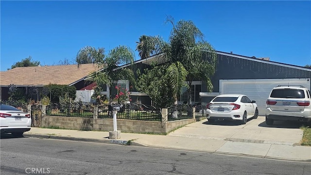 25392 Todd Dr, Moreno Valley, CA 92553 - view of property hidden behind natural elements featuring a fenced front yard, concrete driveway, and a garage