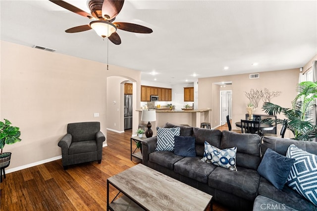 13014 Bermuda Ave, Chino, CA 91710 - living room featuring a ceiling fan, wood finished floors, arched walkways, and recessed lighting