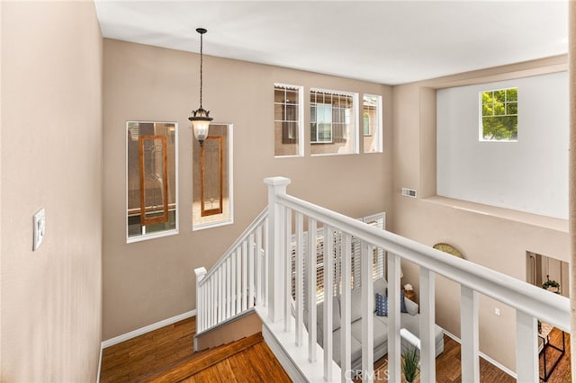 13014 Bermuda Ave, Chino, CA 91710 - stairs featuring wood finished floors and baseboards