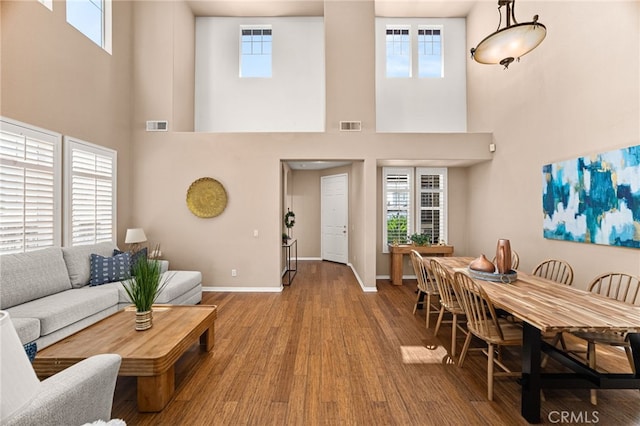 13014 Bermuda Ave, Chino, CA 91710 - living room featuring a high ceiling and wood finished floors
