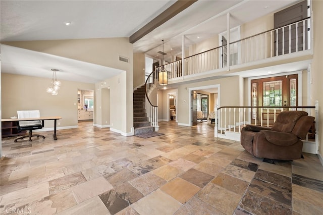 27681 Paseo Esteban, San Juan Capistrano, CA 92675 - living area with stone tile floors, high vaulted ceiling, a chandelier, stairway, and a desk
