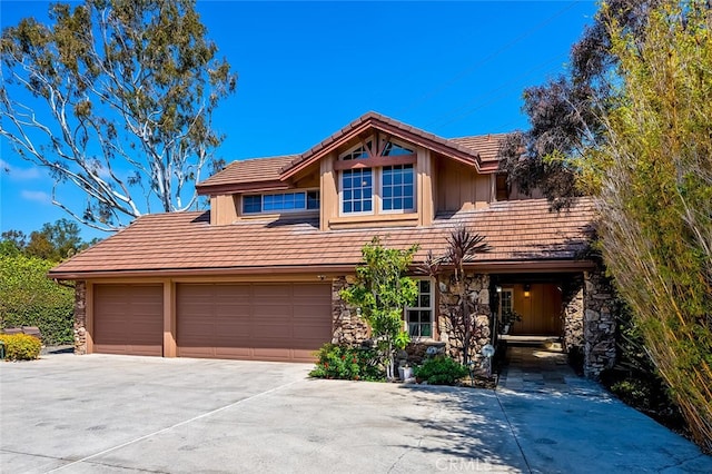 27681 Paseo Esteban, San Juan Capistrano, CA 92675 - view of front of house with stone siding, a tiled roof, and concrete driveway