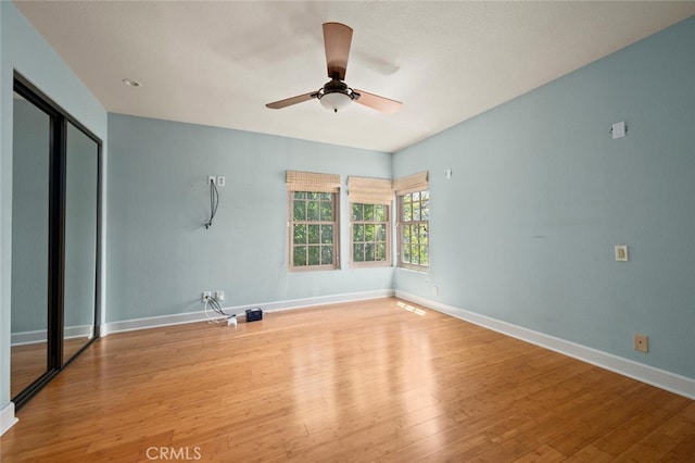27681 Paseo Esteban, San Juan Capistrano, CA 92675 - unfurnished bedroom with wood finished floors, a ceiling fan, and a closet