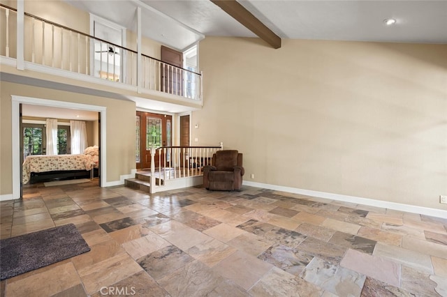 27681 Paseo Esteban, San Juan Capistrano, CA 92675 - living area with stone tile flooring, beamed ceiling, a high ceiling, and recessed lighting