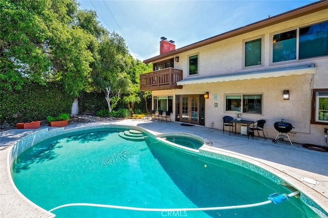 27681 Paseo Esteban, San Juan Capistrano, CA 92675 - view of swimming pool featuring french doors, a patio area, grilling area, and a pool with connected hot tub