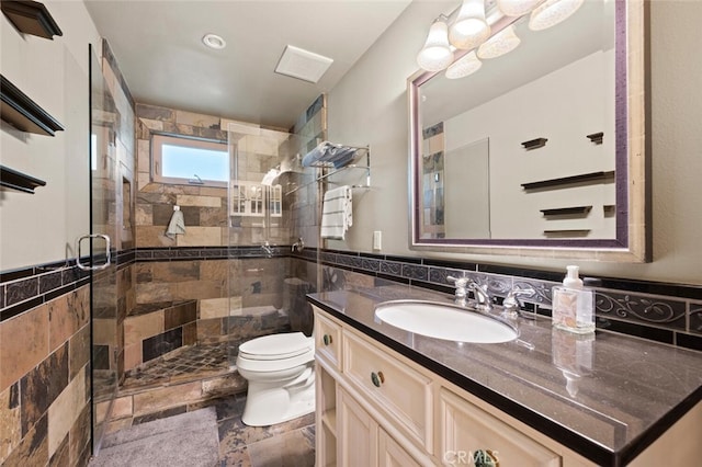 27681 Paseo Esteban, San Juan Capistrano, CA 92675 - bathroom featuring tile walls, vanity, a shower stall, and stone tile floors