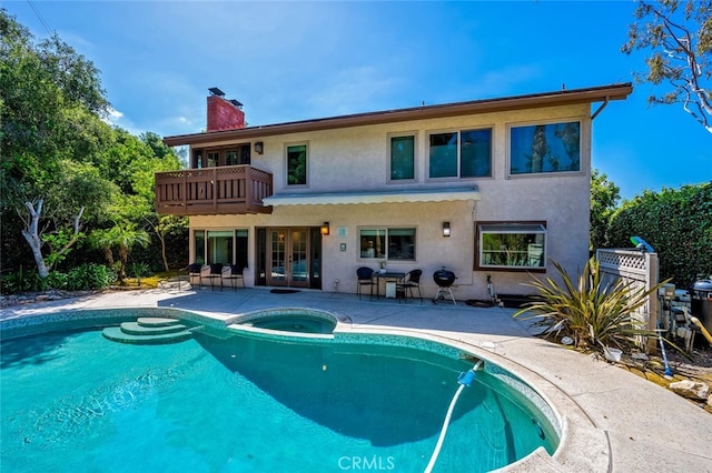 27681 Paseo Esteban, San Juan Capistrano, CA 92675 - back of property with french doors, a balcony, stucco siding, a chimney, and a patio
