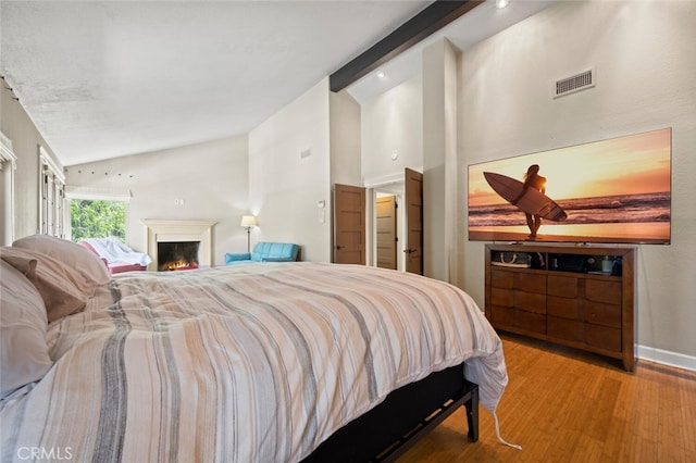 27681 Paseo Esteban, San Juan Capistrano, CA 92675 - bedroom featuring wood finished floors and a warm lit fireplace