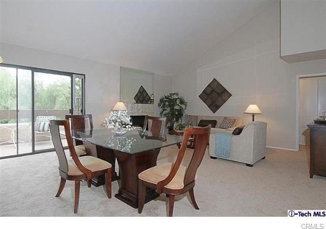 640 S Lake Ave Unit 306, Pasadena, CA 91106 - dining room with light colored carpet and lofted ceiling