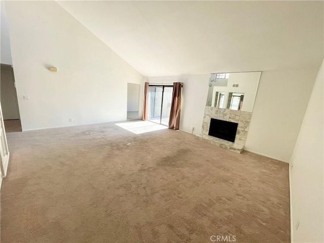 640 S Lake Ave Unit 306, Pasadena, CA 91106 - unfurnished living room with carpet flooring, high vaulted ceiling, and a stone fireplace