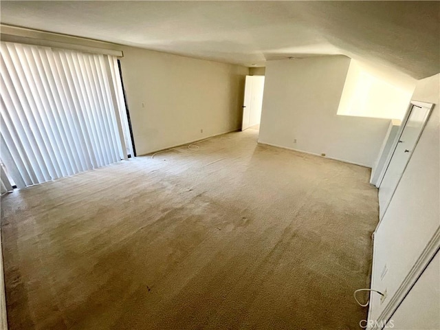640 S Lake Ave Unit 306, Pasadena, CA 91106 - unfurnished room with light carpet and vaulted ceiling