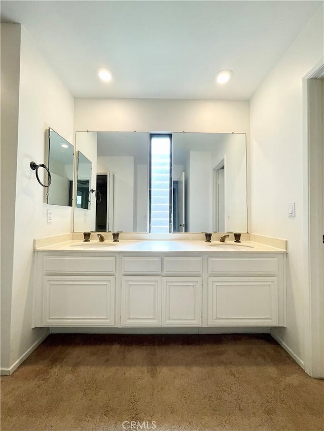 640 S Lake Ave Unit 306, Pasadena, CA 91106 - bathroom featuring double vanity, carpet, and recessed lighting
