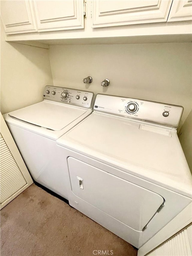 640 S Lake Ave Unit 306, Pasadena, CA 91106 - laundry area featuring washer and dryer, carpet flooring, and cabinet space