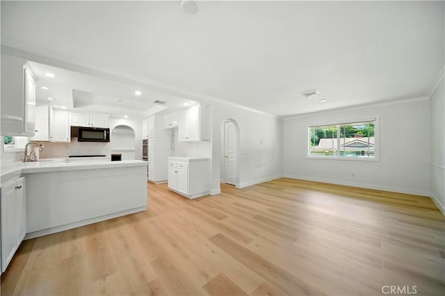734 Puma Canyon Ln, Glendora, CA 91740 - kitchen featuring black microwave, ornamental molding, white cabinets, open floor plan, and light countertops