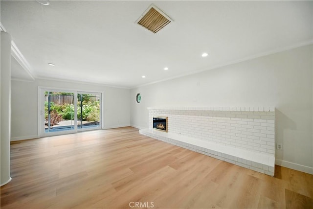 734 Puma Canyon Ln, Glendora, CA 91740 - unfurnished living room featuring crown molding, a brick fireplace, light wood-style flooring, and recessed lighting