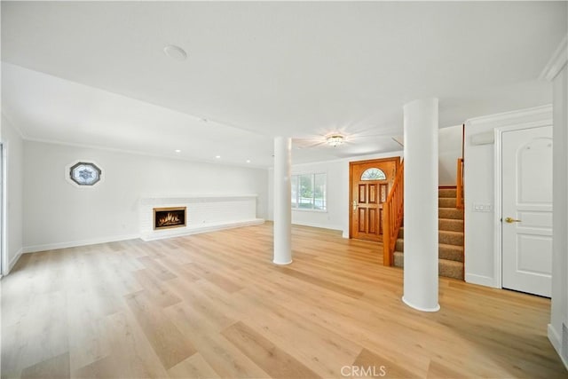 734 Puma Canyon Ln, Glendora, CA 91740 - unfurnished living room with light wood-style flooring, stairway, and a fireplace