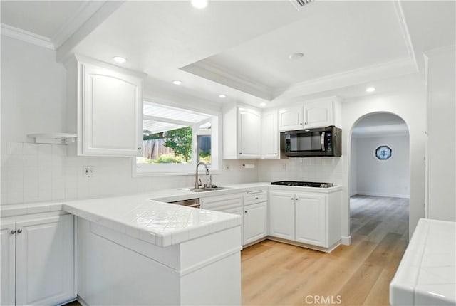 734 Puma Canyon Ln, Glendora, CA 91740 - kitchen featuring crown molding, a tray ceiling, tile countertops, white cabinetry, and gas cooktop