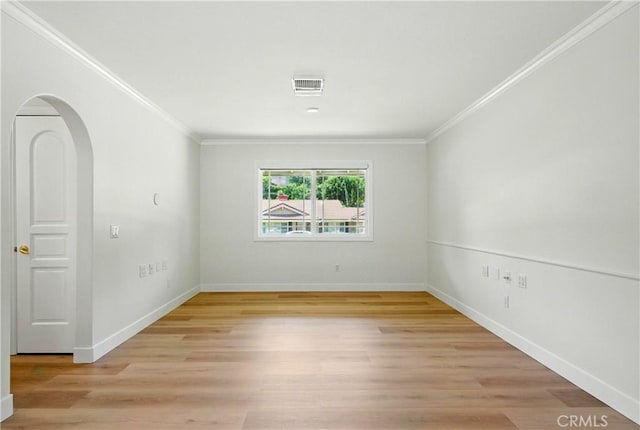 734 Puma Canyon Ln, Glendora, CA 91740 - empty room with crown molding, arched walkways, and light wood-style floors