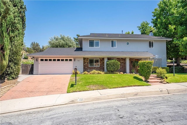 734 Puma Canyon Ln, Glendora, CA 91740 - traditional-style house featuring a garage, driveway, and stucco siding