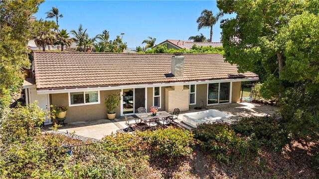 2805 Via Montecito, San Clemente, CA 92672 - back of property with a tile roof, an outdoor hot tub, a patio, and stucco siding