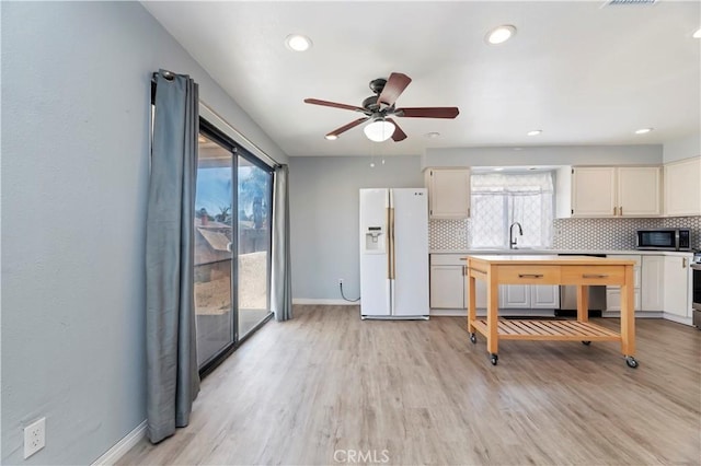 2294 Daisy Way, Hemet, CA 92545 - kitchen featuring stainless steel appliances, backsplash, ceiling fan, light wood-type flooring, and recessed lighting