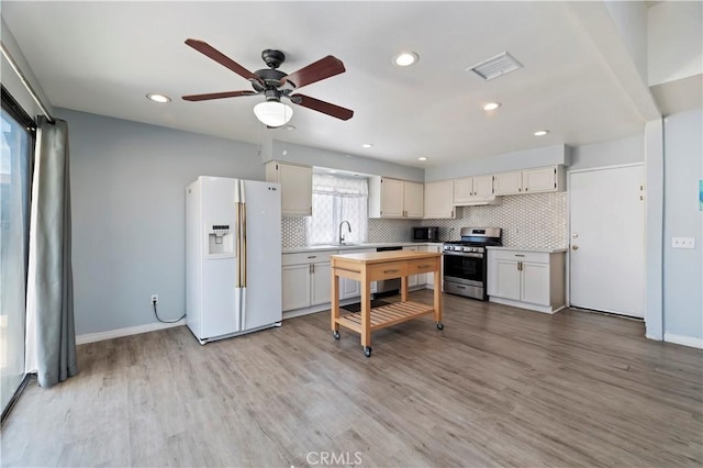 2294 Daisy Way, Hemet, CA 92545 - kitchen featuring stainless steel appliances, light countertops, backsplash, ceiling fan, and recessed lighting