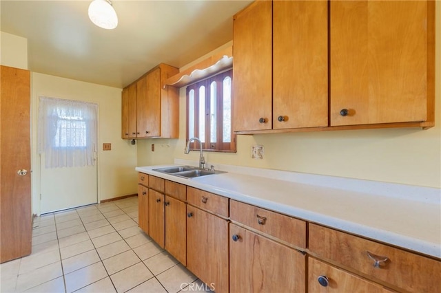 2001 W Jan Way, Santa Ana, CA 92704 - kitchen featuring light countertops, plenty of natural light, and light tile patterned flooring