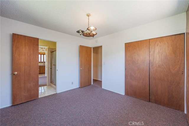2001 W Jan Way, Santa Ana, CA 92704 - unfurnished bedroom featuring carpet flooring, a chandelier, and a closet