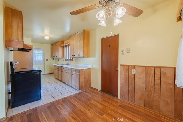 2001 W Jan Way, Santa Ana, CA 92704 - kitchen featuring electric range, ceiling fan, light countertops, light wood-type flooring, and extractor fan