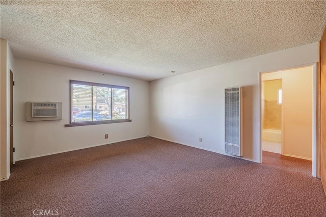 2001 W Jan Way, Santa Ana, CA 92704 - carpeted spare room with a heating unit, a wall mounted air conditioner, and a textured ceiling