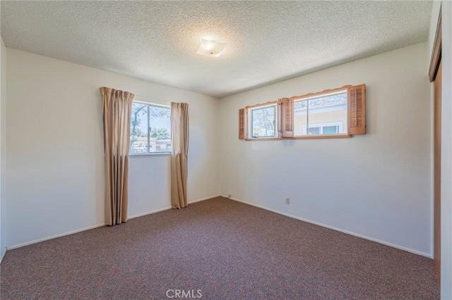 2001 W Jan Way, Santa Ana, CA 92704 - carpeted empty room with a textured ceiling and baseboards